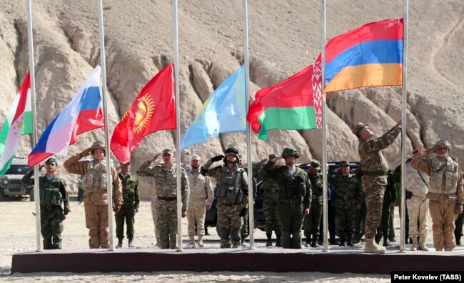 The national flags of Tajikistan, Russia, Kyrgyzstan, Kazakhstan, Belarus, and Armenia fly during a CSTO joint military exercise near the Tajik-Afghan border on October 18.