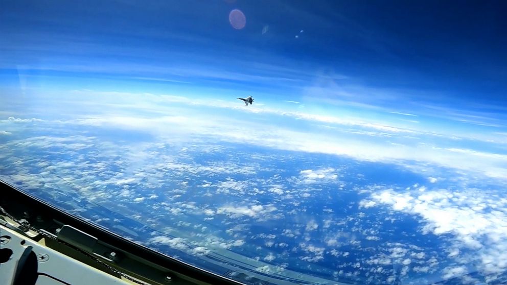 A People's Republic of China J-16 fighter pilot performs a maneuver during the intercept of a U.S. Air Force RC-135 aircraft over the South China Sea, May 26, 2023.