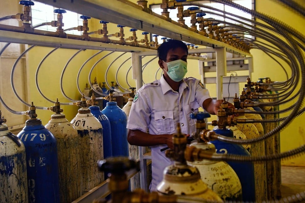 A worker monitors the oxygen tank feed to various wards at a hospital in Aceh, Indonesia. Photo: AFP