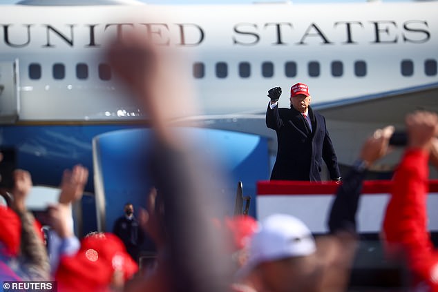 Last year Trump switched to airport rallies, using Air Force One as a backdrop, as he did in Fayetteville, North Carolina, in November (pictured)