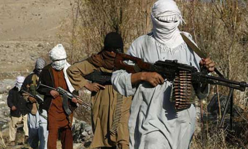 In this file photo, Taliban fighters pose with weapons in an undisclosed location in Nangarhar province. — Reuters/ File