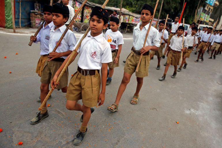 Volunteers of the Hindu nationalist organization Rashtriya Swayamsevak Sangh (RSS) march during Vijay Dashmi festival celebrations in Allahabad, India, Thursday, Oct. 22, 2015. Vijayadashami, also known as Dussehra, commemorates the victory of the Hindu god Rama over Ravana, an evil ruler who had abducted Rama's wife, Sita. The festivity is marked with the burning of effigies of Ravana, signifying the victory of good over evil. (AP Photo/Rajesh Kumar Singh)