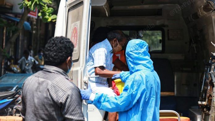 Healthcare workers in PPE suits escort Covid patients | Representational image | Photo: Manisha Mondal | ThePrint