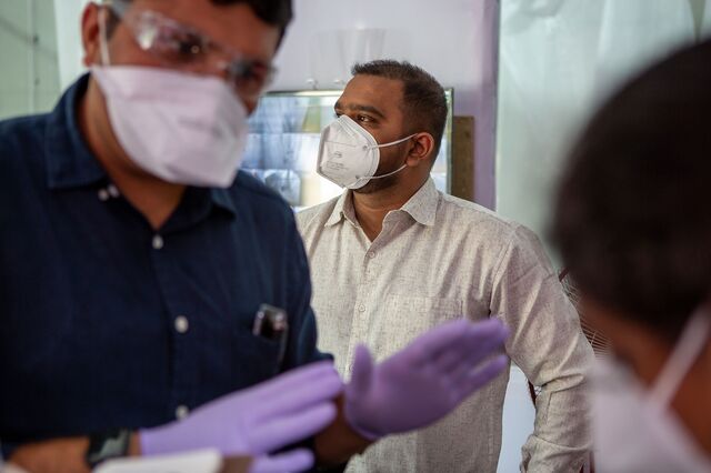 Dr. Asad Khan, (middle) , overlooking the DCHC (Dedicated Covid Health Center) set up at the Sion Bandra Link Road for all Dharavi positive cases, with Mr. Kiran Dighavkar, BMC Assistant Municipal Commissioner (Blue shirt) inspecting the DCHC. 10th July 2020.