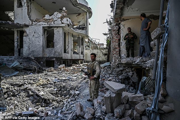 Dawa Khan Menapal was shot dead on Friday, after minister Bismillah Mohammadi escaped a bomb attack. Pictured: Afghan security at scene of bomb explosion in Kabul on August 4