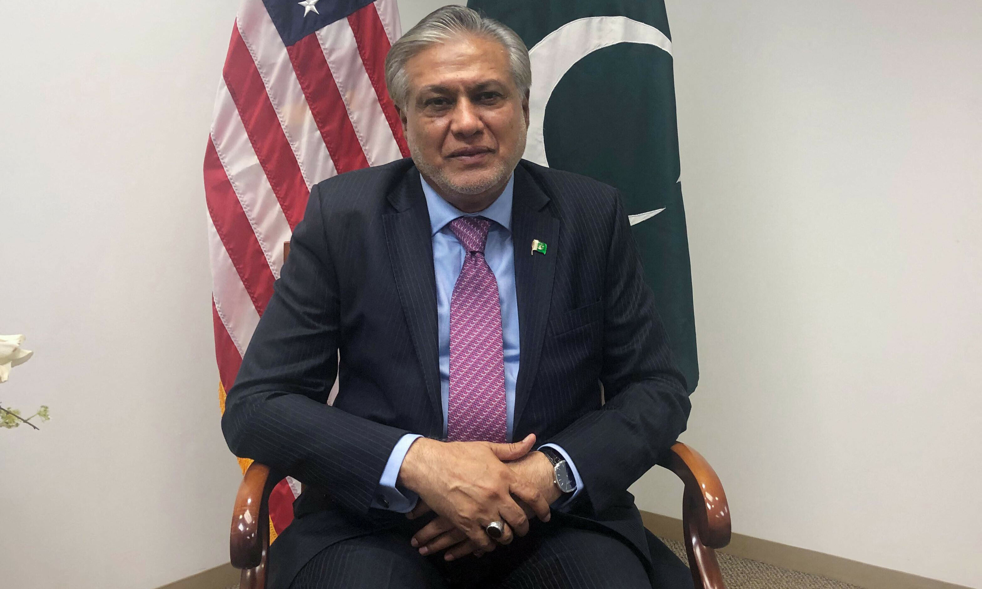 <p>Finance Minister Ishaq Dar speaks during an interview in Washington, DC, on Friday. — AFP</p>