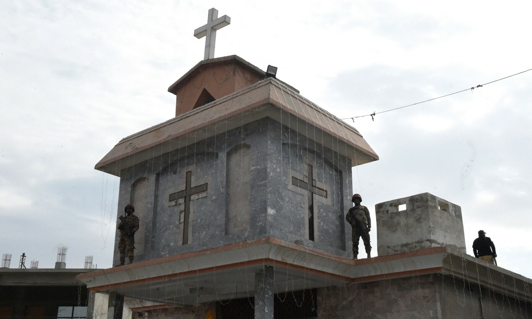 Members of the Frontier Constabulary personnel stand guard during a Christmas prayer ceremony at the Bethel Memorial Methodist Church in Quetta on December 25, 2022. — AFP