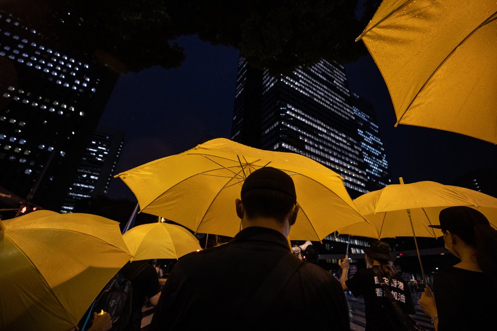 Protesters march through the Shinjuku area of Tokyo during a protest against the Chinese Communist Party on July 1, the 100th anniversary of its founding.