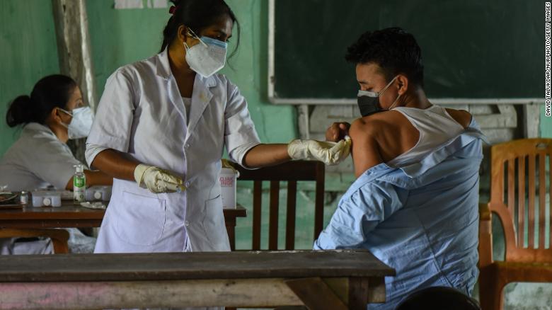 A young man receives a Covid-19 vaccine in Guwahati, India, on Saturday, May 8.