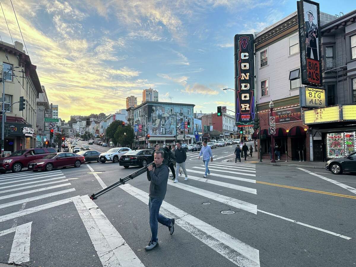 Milan Nosek, a journalist from the Czech Republic, carries a camera on a Columbus Avenue in San Francisco’s North Beach neighborhood. Nosek and the team of television journalists he was with were robbed of their camera and other equipment nearby while covering the APEC summit. 