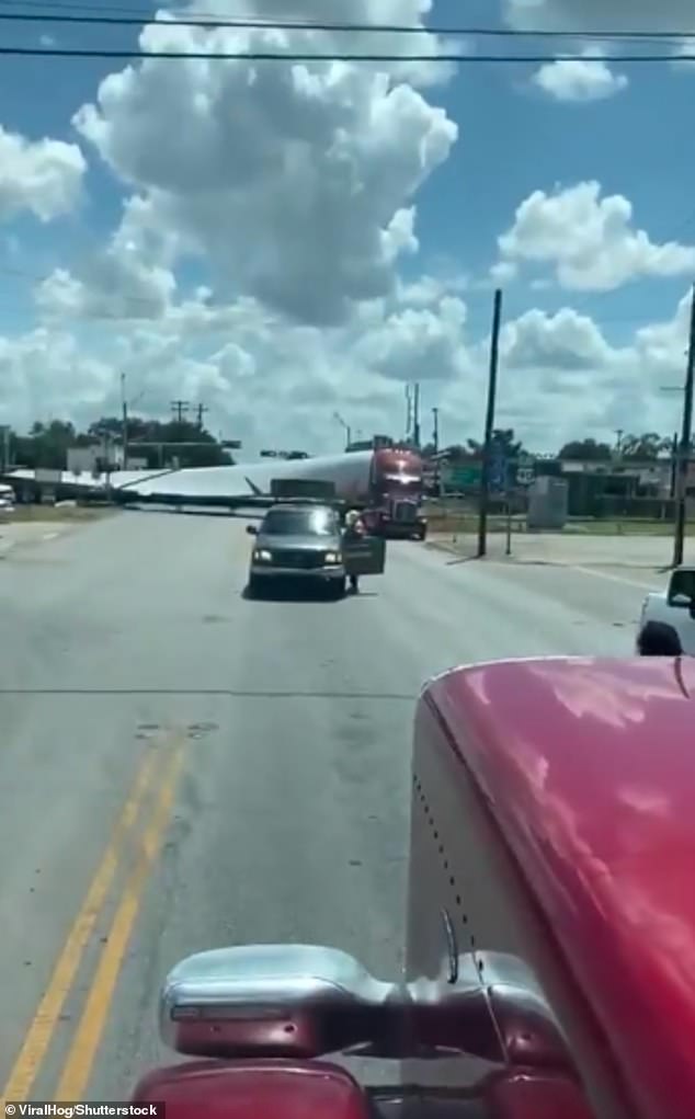 The escort vehicle for Canup's company was blocking the road in front him as the semi was seen sticking halfway out into the road with the other half stuck across the tracks