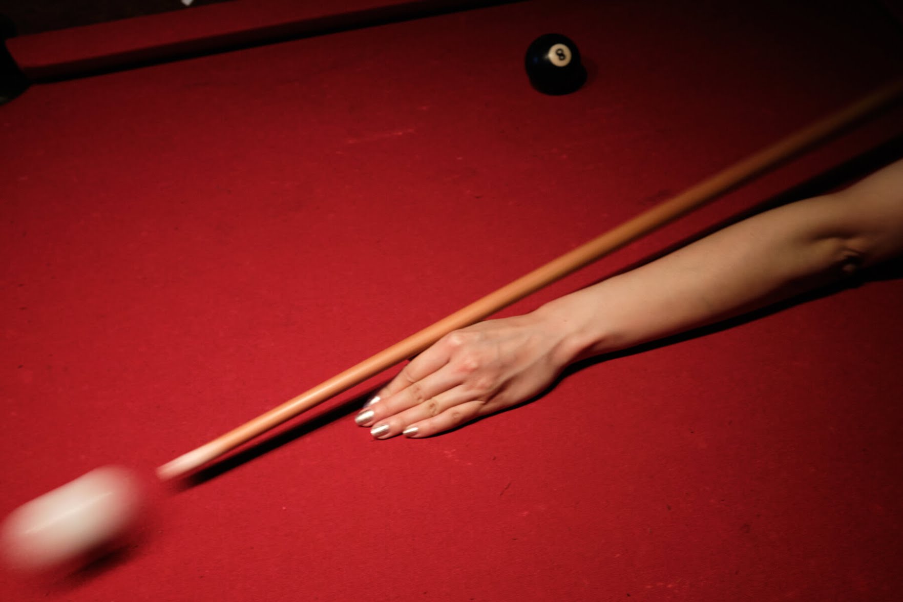 Playing pool at Ace Bar in the East Village. “My cousin Jane and I used to go to different bars in the city to play, and I still like to cap off the day with a round.”