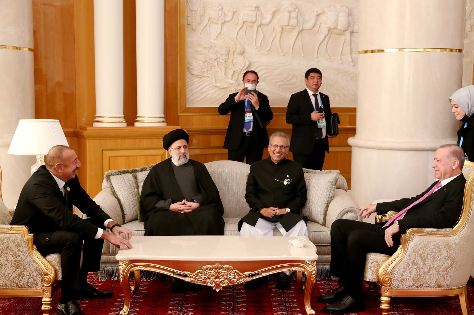 A handout photo made available by Turkish Presidential Press office shows Recep Tayyip Erdoğan (R), Presidents of Iran Ebrahim Raisi (2-L), Azerbaijan Ilham Aliyev (L), Pakistani President Arif Alvi (2-R) chat at 15th Summit of Economic Cooperation Organization (ECO) in Ashgabat, Turkmenistan, Nov. 28, 2021. (EPA via Turkish Presidency)