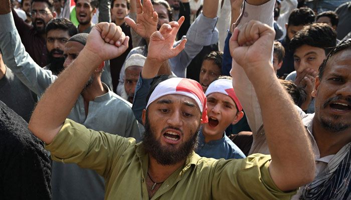 Activists of the PMML party shout slogans during an anti-Israel demonstration in Rawalpindi on October 13, 2023, amid the ongoing conflict between Israel and Hamas. — AFP