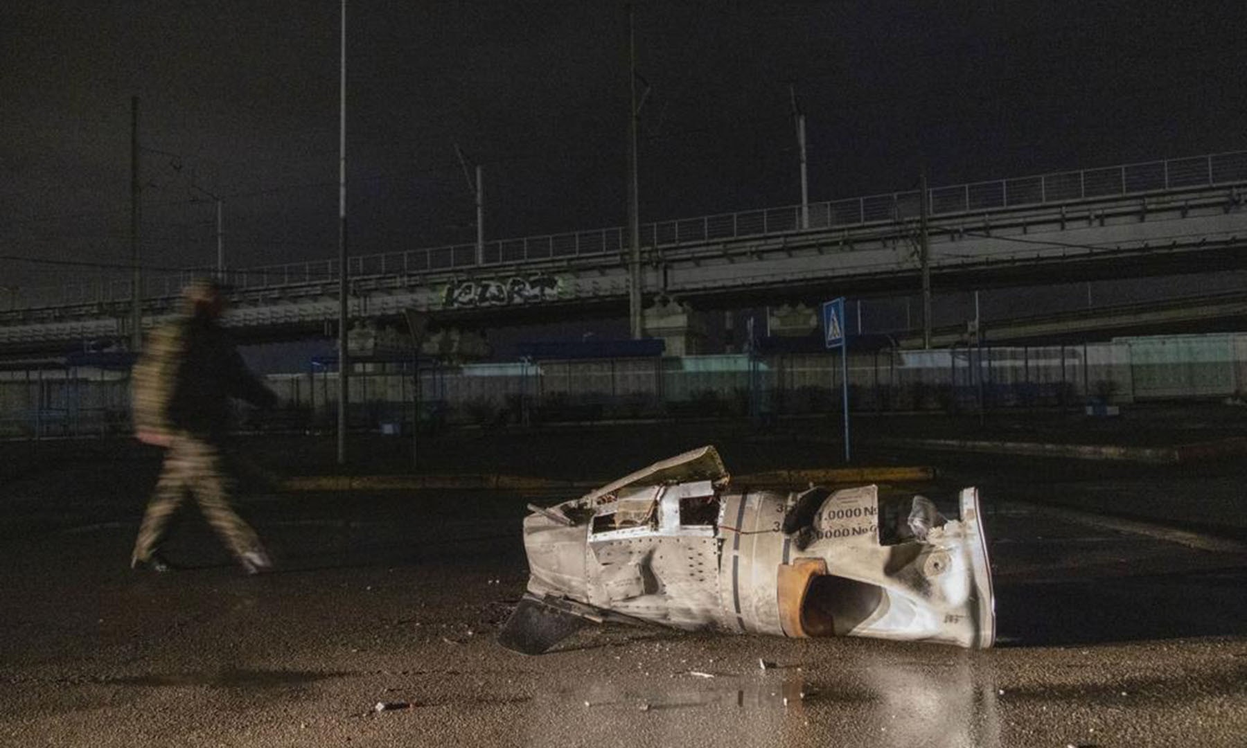 The remains of a Russian missile lies on the ground in Kyiv, Ukraine on Thursday. — AP