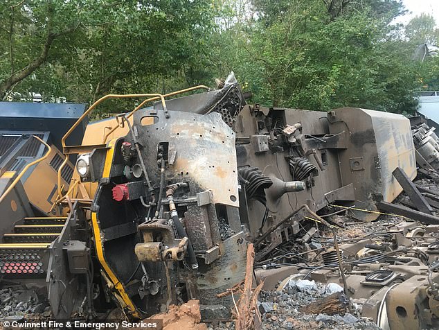 A train derailment in metro Atlanta early Sunday sparked a small fire, created runoff concerns and briefly forced some residents from their homes, a fire official said