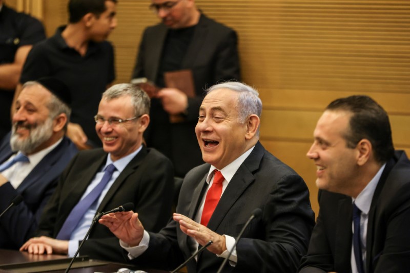 Leader of Israeli Opposition Benjamin Netanyahu, reacts during a meeting with his party in the Knesset, the Israeli parliament, in Jerusalem June 14, 2021. REUTERS/Ronen Zvulun