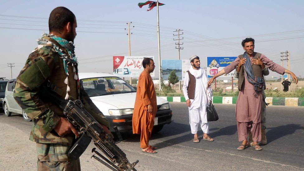 An Afghan National Army (ANA) soldier searches a man at a checkpoint in the Guzara district of Herat province, Afghanistan July 9, 2021. REUTERS/Jalil Ahmad