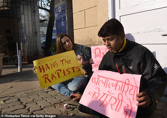 Women's rights activist Yogita Bhayana (pictured left at a previous anti-rape protest) said the gang-rape and parade 'left me speechless' and called for the arrest of all involved