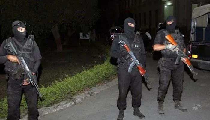 CTD Balochistan personnel stand with guns. Photo: File