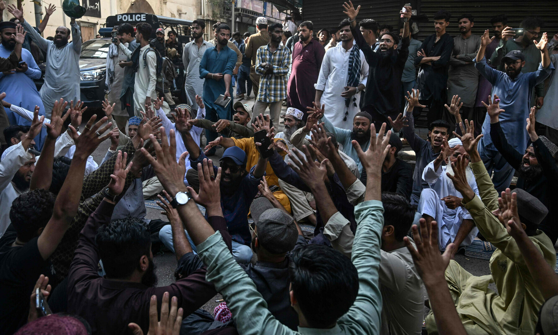 Supporters of the TLP shout slogans outside an Ahmadi place of worship in Karachi’s Saddar on April 19, 2025. — AFP