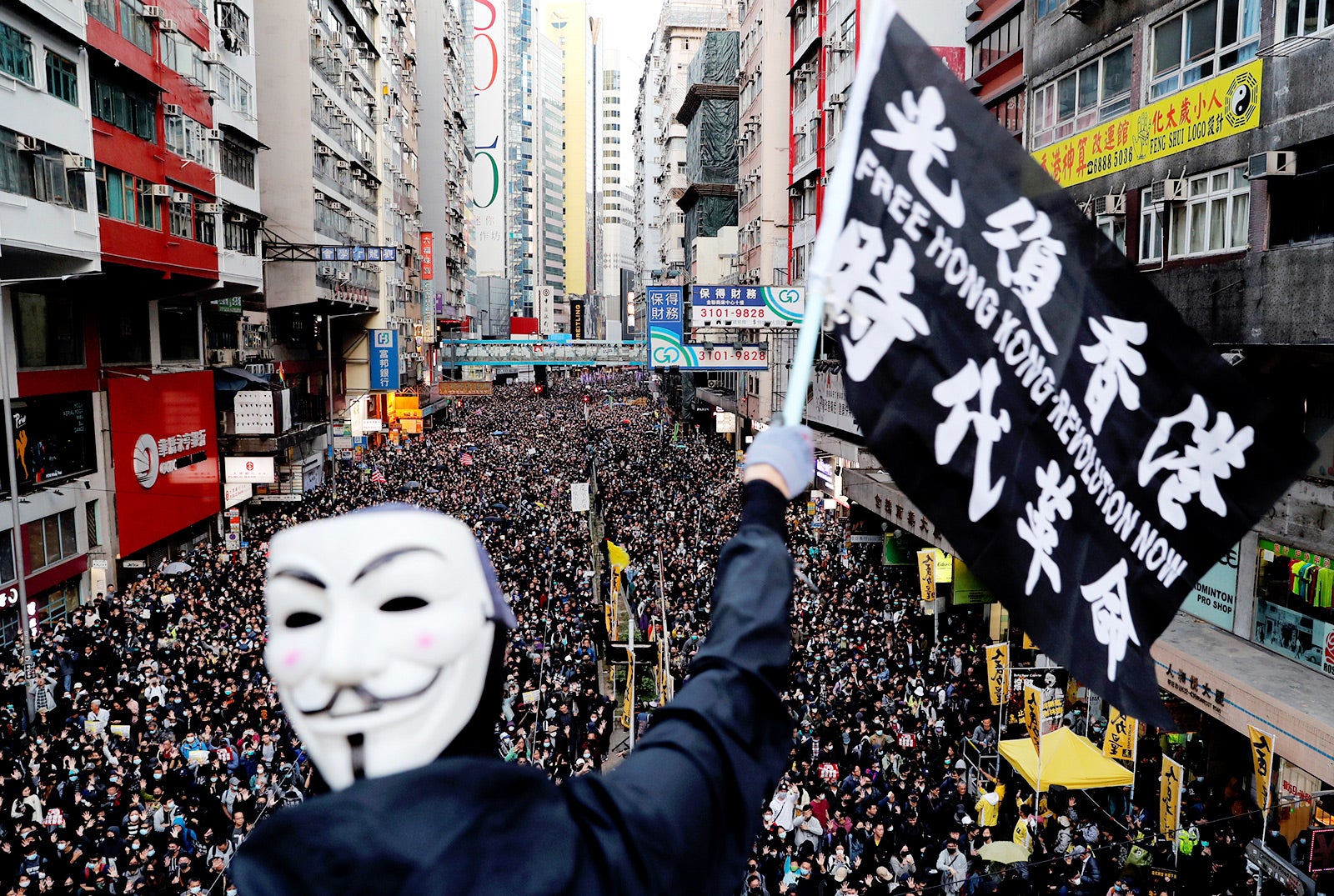 The slogan in Chinese on the flag, “Liberate Hong Kong, the Revolution of Our Times,” was a common chant during the 2019 protests. But since the imposition of the National Security Law, Hong Kong authorities have prohibited both the chant and pro-democracy protests have been prohibited in Hong Kong. The group that has long organized peaceful marches, Civil Human Rights Front, is also no longer functioning and its convenor has been in custody since.