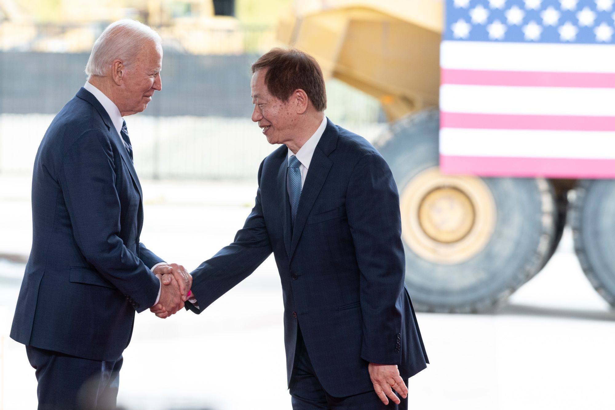 US President Joe Biden shakes hands with Mark Liu, chairman of TSMC, right, during a “First Tool-In” ceremony at the TSMC facility under construction in Phoenix, Arizona, US. Photo: Bloomberg