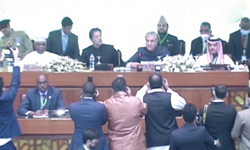 Prime Minister Imran Khan and Foreign Minister Shah Mehmood Qureshi sit among foreign dignitaries during an extraordinary session of the OIC in Islamabad on Sunday. — Photo: DawnNewsTV