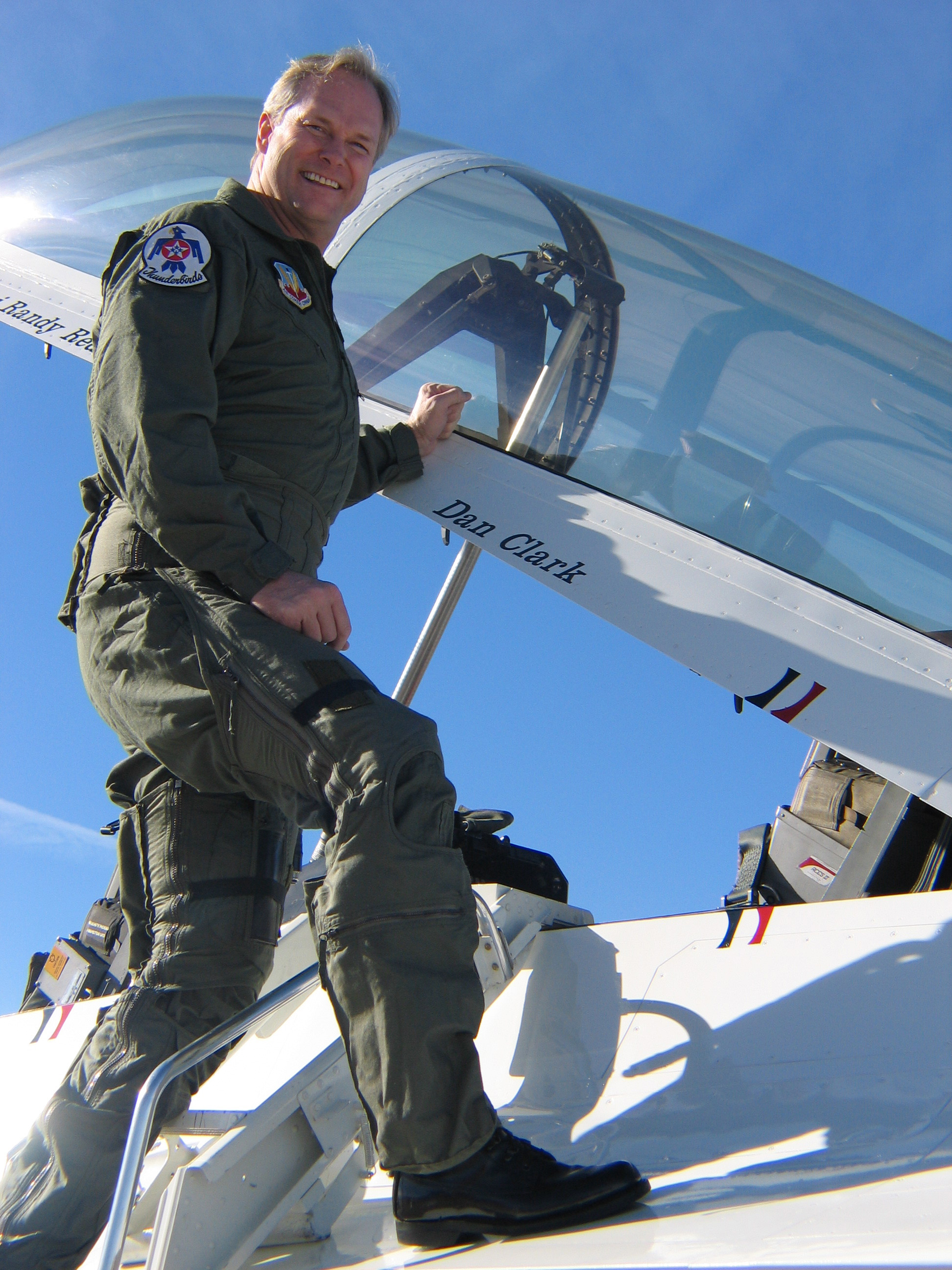 Dan_Clark_in_a_flight_suit_on_a_jet_fighter.jpg