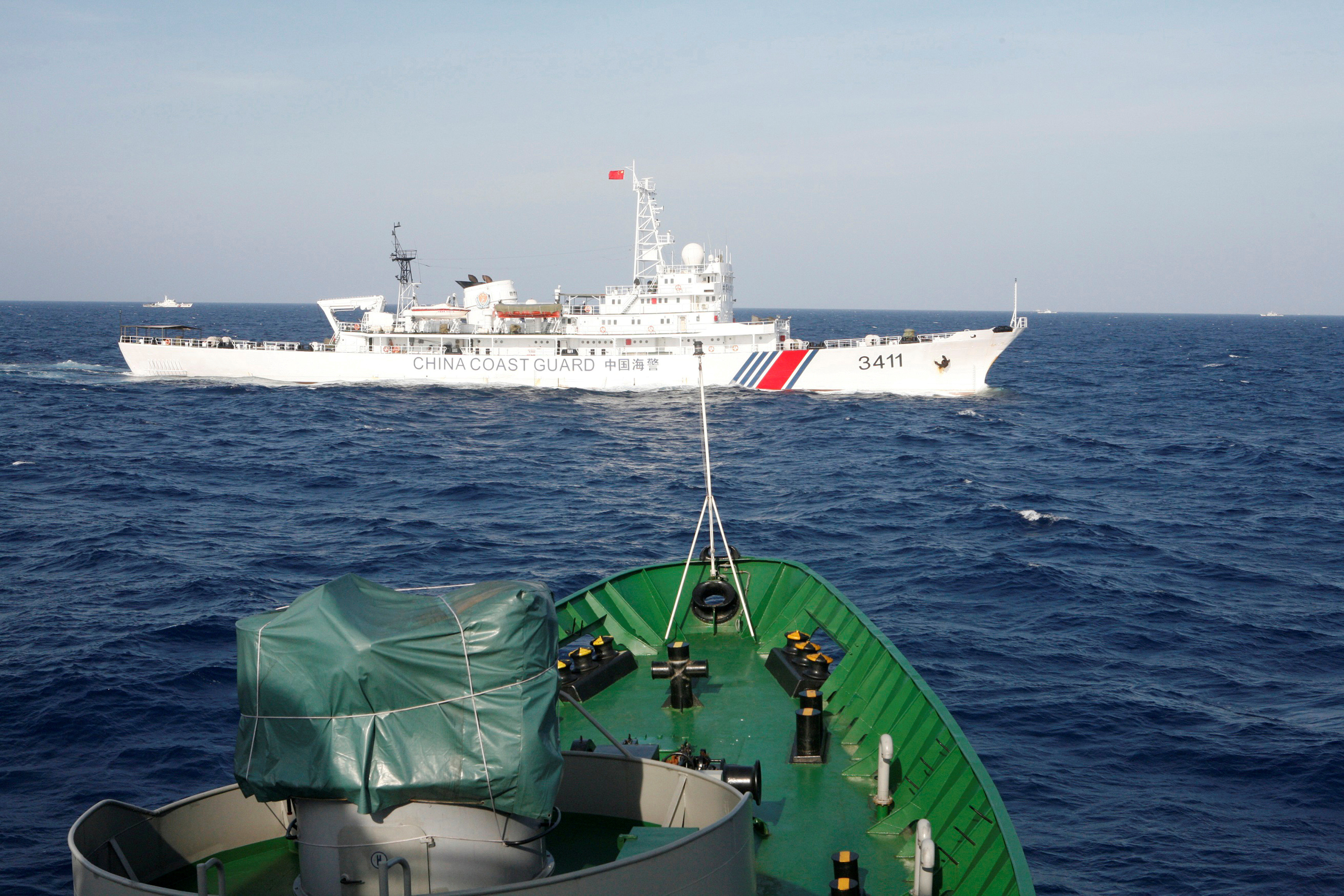 A ship of Chinese Coast Guard is seen near a ship of Vietnam Marine Guard in the South China Sea