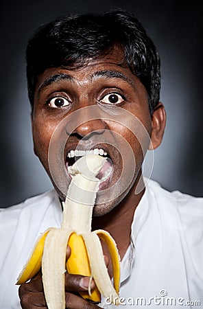 indian-man-eating-banana-18717558.jpg