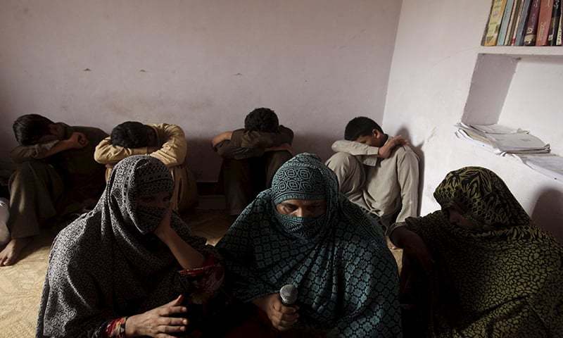 Children whose families say have been abused, hide their faces while their mothers are interviewed by a Reuters correspondent in their village of Husain Khan Wala on August 9, 2015 — Reuters/File