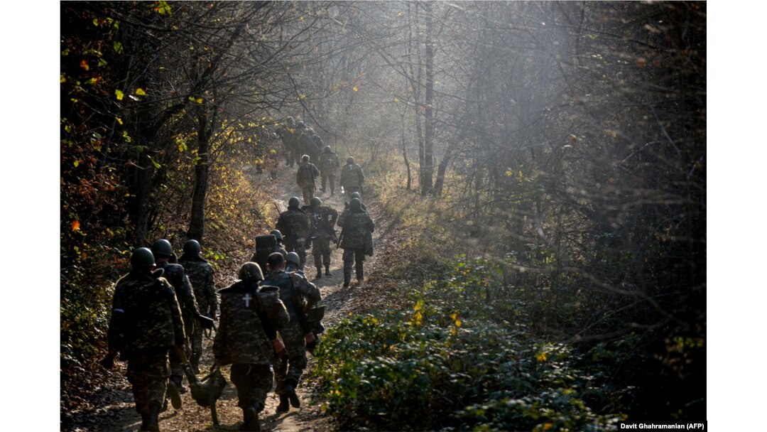 Ethnic Armenian fighters march to their defense positions around the city of Shushi/Susa in Nagorno-Karabakh.