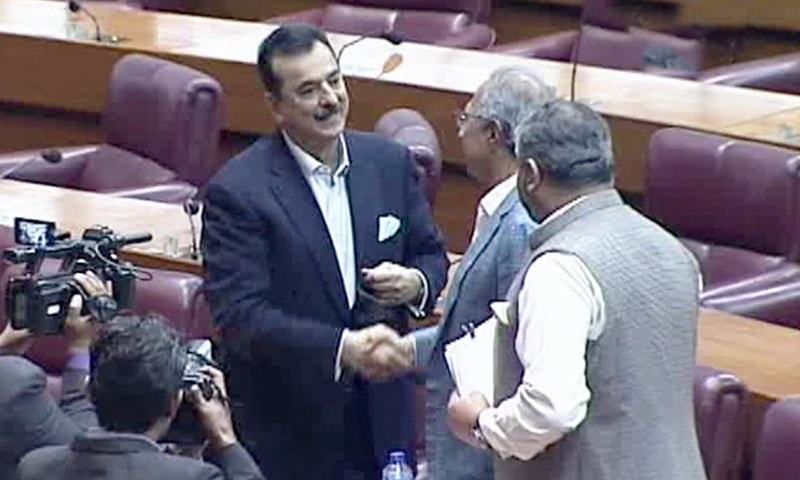 PPP's Yousuf Raza Gilani shakes hands with PTI's Hafeez Shaikh after the former won the election.