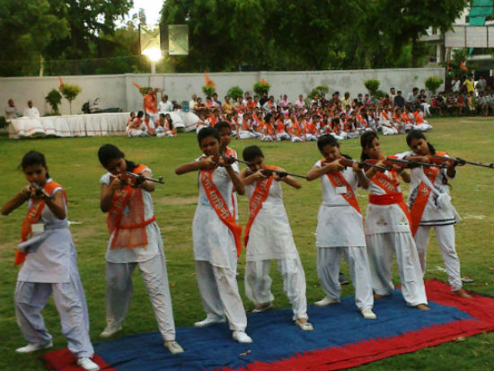 1371403777_Photo%20130616-1%20Girls%20shooting%20thru%20Air%20Guns%20during%20Durga%20Vahini%20Shivir%20Samapan%20Samaroh%202013.jpg