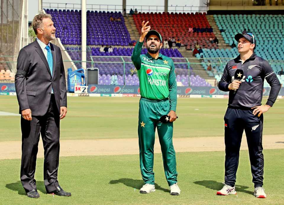 Babar Azam, in his 100th ODI, spins the coin as Tom Latham and Chris Broad look on