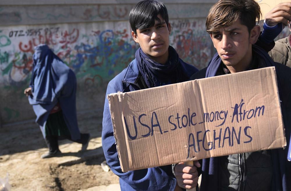 Afghan protesters hold placards and shout slogans against US during a protest condemning President Joe Biden's decision, in Kabul, Afghanistan. — AP