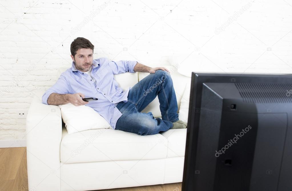 depositphotos_101417838-stock-photo-young-happy-man-watching-tv.jpg