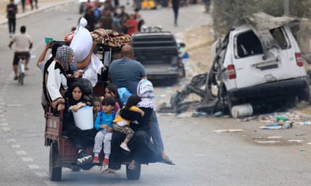 A Palestinian family flees south from the northern Gaza Strip