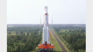 A Chinese Long March 5B rocket carrying the Mengtian space station module rolls out to the launch pad on Oct. 25, 2022.