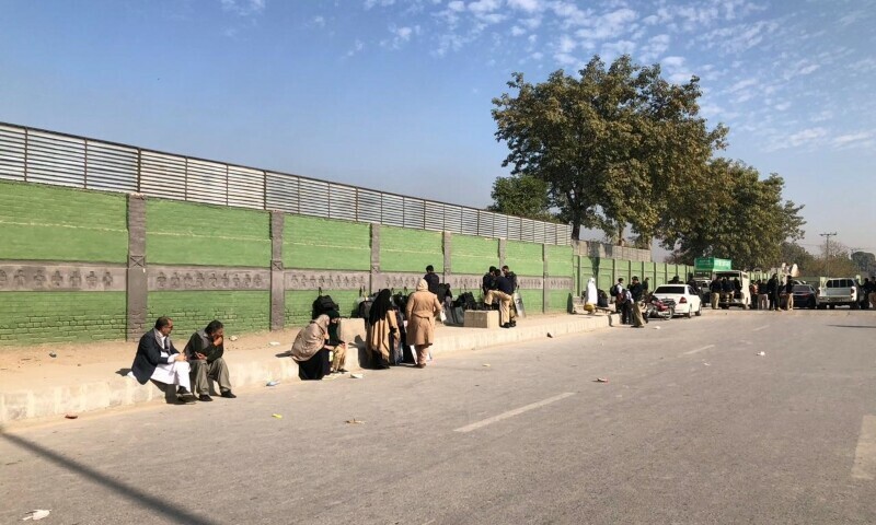 <p>Parents of APS martyrs gather at Peshawar’s Khyber Road on Friday. — Photo by Sirajuddin</p>