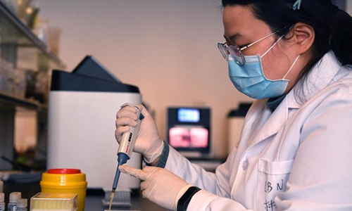 A staff checks the nucleic acid test kit at the plant of Luoyang Ascend Biotechnology Co., Ltd in Luoyang, central China's Henan Province, March 4, 2020. Photo: Xinhua 