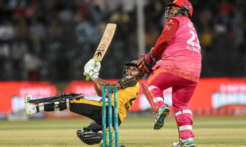 <p>Peshawar Zalmi’s Mohammad Haris (L) plays a shot during the Pakistan Super League (PSL) Twenty20 cricket eliminator match between Peshawar Zalmi and Islamabad United at the Gaddafi Cricket Stadium in Lahore on March 16, 2023. — AFP</p>