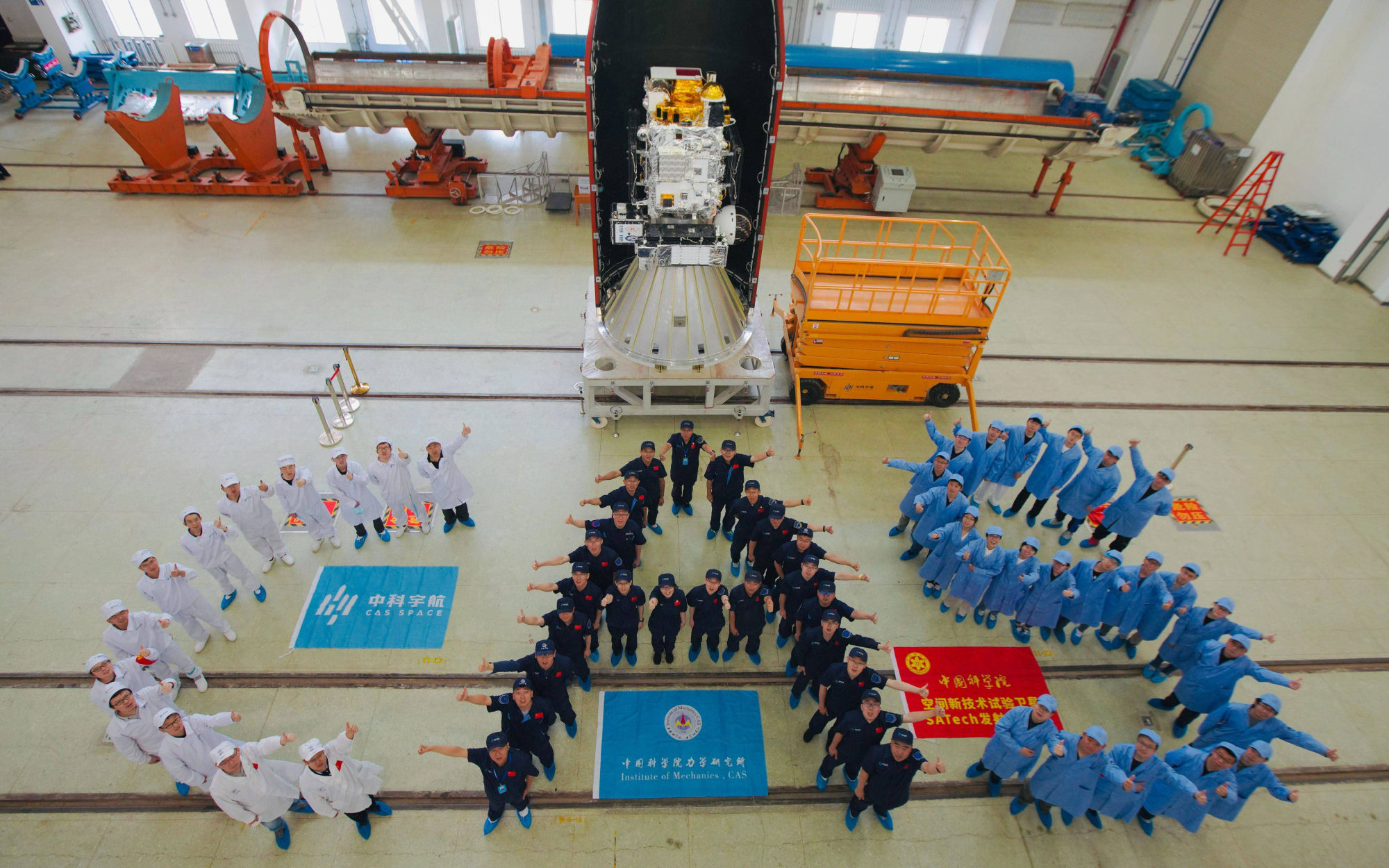 The Chinese Academy of Sciences team mark the satellite launch on Wednesday. Photo: Handout