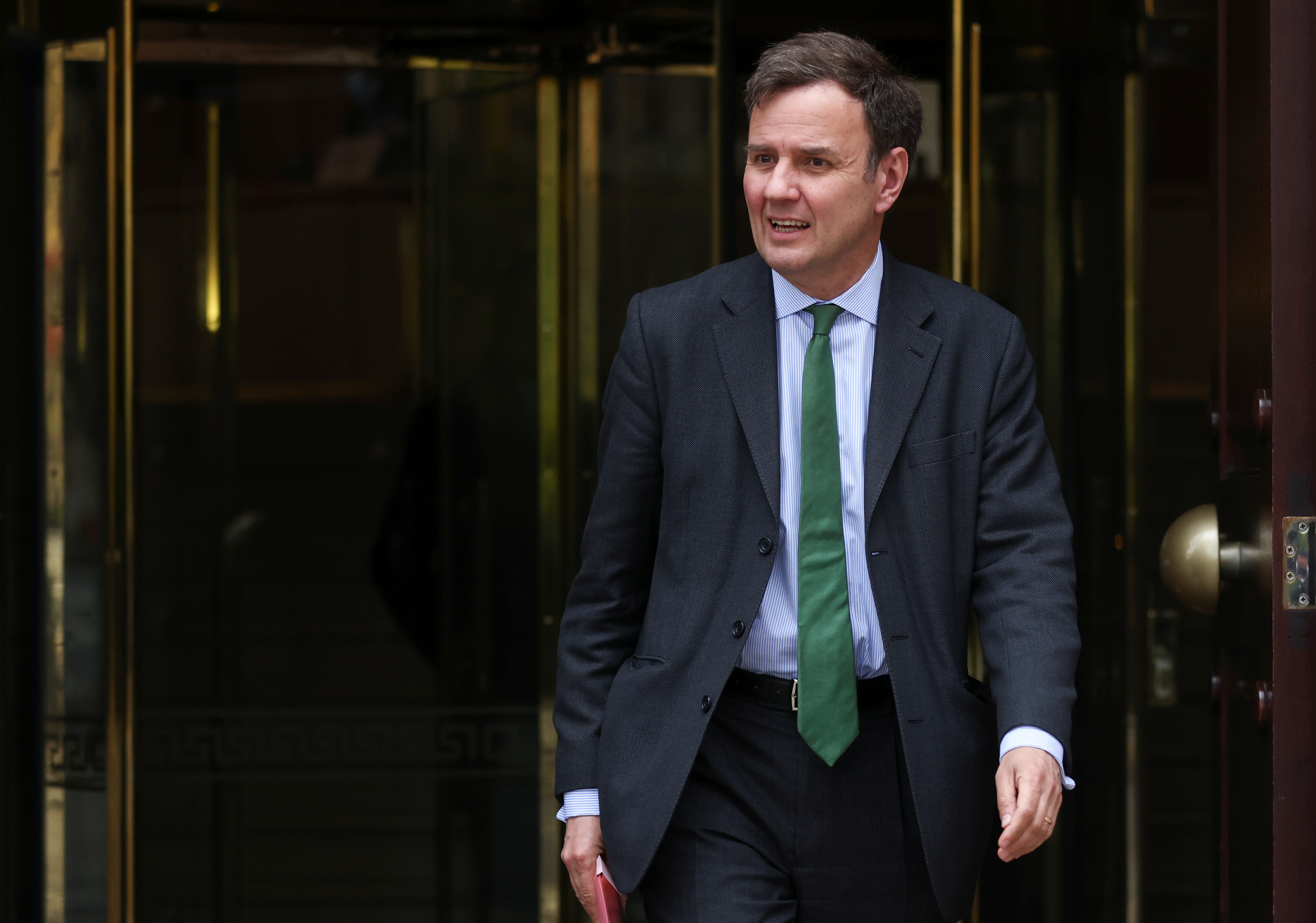 Minister of State for Business, Energy and Clean Growth Greg Hands leaves after a radio interview in Westminster, London