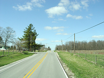 A country road recedes into the distance.