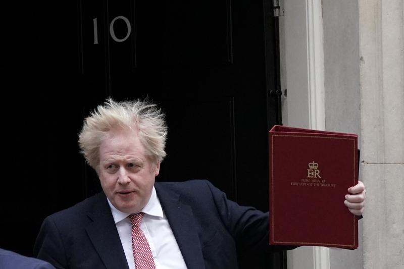 Britain's Prime Minister leaves 10 Downing Street, London, Monday Feb. 21, 2022, to head to the House of Commons. (Yui Mok/PA via AP)