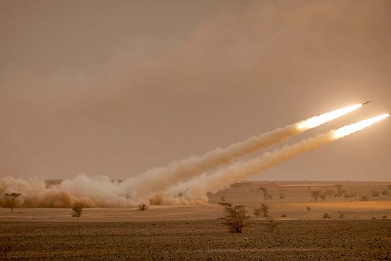 US M142 High Mobility Artillery Rocket System (HIMARS) launchers fire salvoes