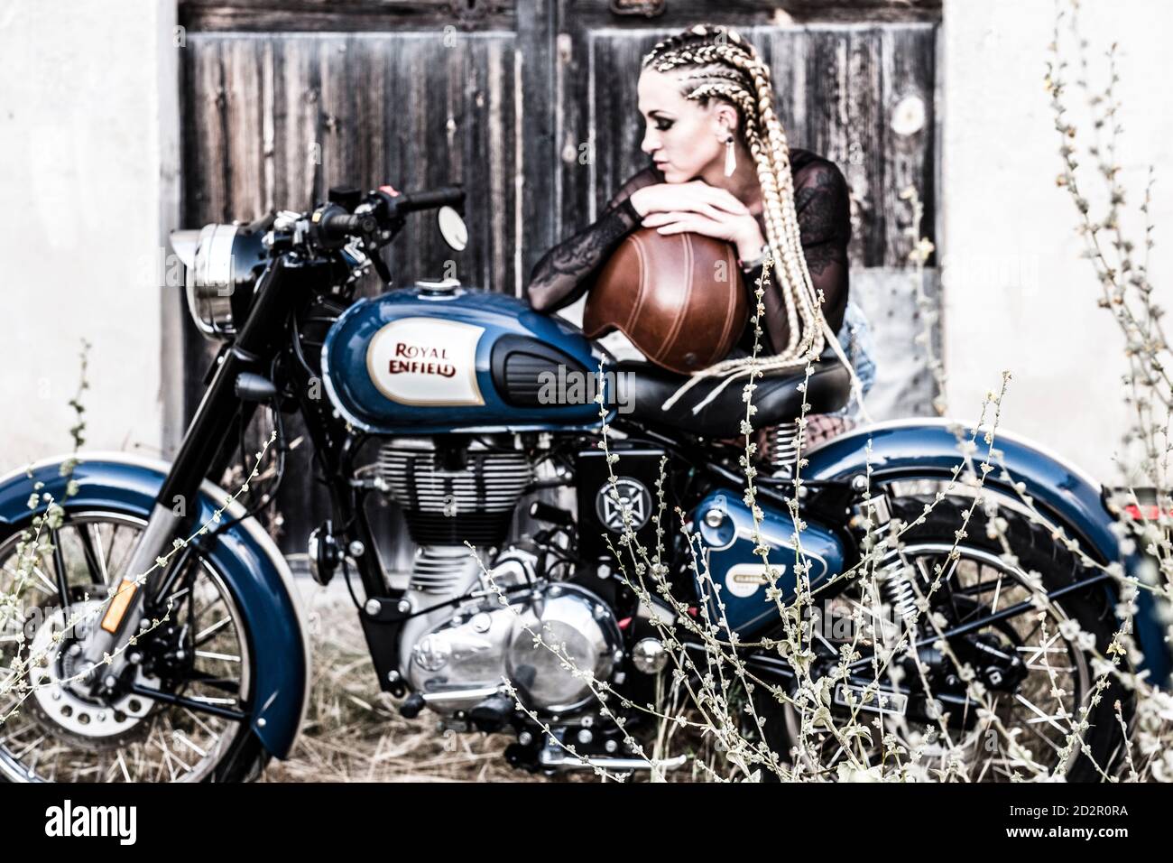 girl-and-royal-enfield-500-motorbike-balearic-islands-2D2R0RA.jpg