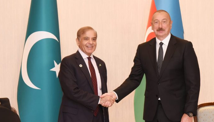 Prime Minister Muhammad Shehbaz Sharif (left) and President of Azerbaijan Ilham Aliyev shake hands during a meeting on the sidelines of the Shanghai Cooperation Organisations Council of Heads of State summit in Samarkand, Uzbekistan, on September 16, 2022. — APP